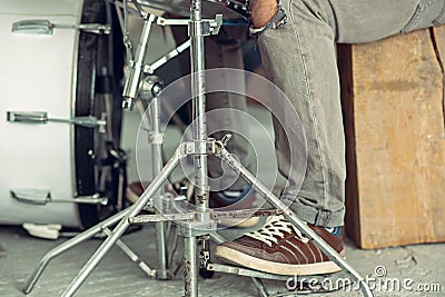 Repetition of rock music band. drummer behind the drum set. Stock Photo