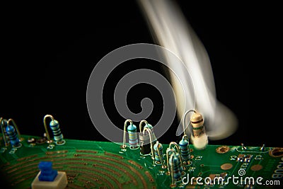 Electronic circuit shorted on resistor on PCB Stock Photo
