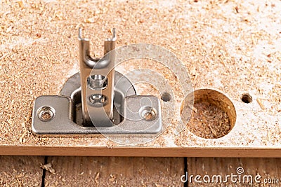 Replacement and assembly of furniture hinges. Small carpentry work in the home workshop Stock Photo
