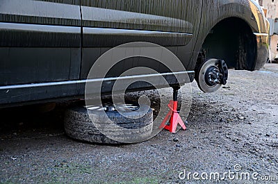 replacement of a brake disc in a car in domestic conditions. the auto Stock Photo