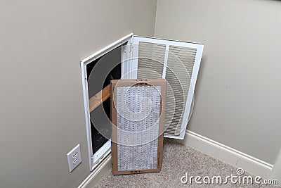 Replacing clean Air filter for home air conditioner Stock Photo