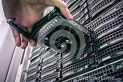 Replacing a module in a powerful server hardware. Cloud storage technology concept. Hosting platform of the Internet provider. Stock Photo
