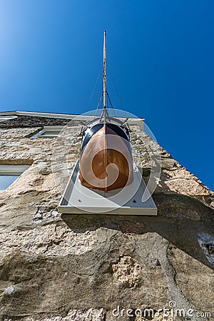 Replica of the Charles W. Morgan whaling ship juts out of Marine Biological Laboratoryâ€™s Candle House Editorial Stock Photo