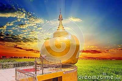 The replica of Phra That In-Kwaen Hanging Golden Rock at Sirey temple, Phuket Stock Photo