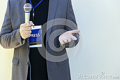 Broadcast journalism concept with copy space. TV reporter at news event, press conference or making media interview. Stock Photo