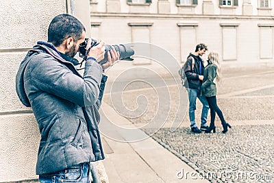 Reporter spying a couple Stock Photo