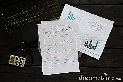 reports and histograms on paper on the table, analytics and statistics on paper, business Stock Photo