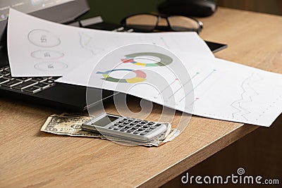 reports and histograms on paper on the table, analytics and statistics on paper, business Stock Photo