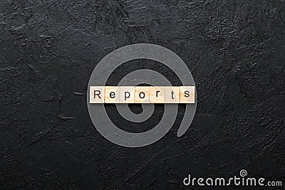 REPORTS word written on wood block. REPORTS text on table, concept Stock Photo