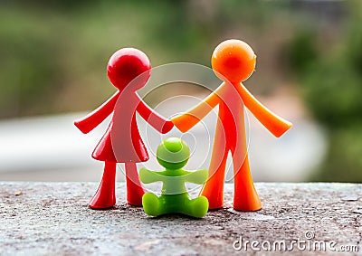 Representation of a family, father, mother and children through dolls Stock Photo