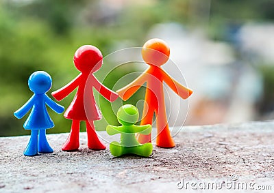 Representation of a family, father, mother and children through dolls Stock Photo