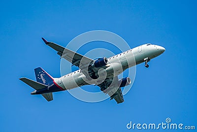 Republic Airlines Embraer ERJ-175LR descends for landing at JFK International Airport in New York Editorial Stock Photo