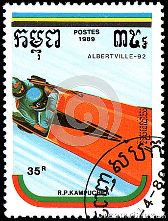 REPUBLIC OF KAMPUCHEA CAMBODIA - CIRCA 1989: postage stamp, printed in Republic of Kampuchea, shows a bobsled. Series Winter Oly Editorial Stock Photo