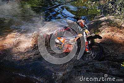 REPUBLIC OF KARELIA, RUSSIA - CIRCA JUNE, 2022: Off-road tournament Ladoga Trophy 2022 in Karelia. Motorcycle racer with Editorial Stock Photo