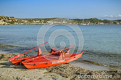 Rescue boat empty beach close to Capo Testa in Sardinia Stock Photo