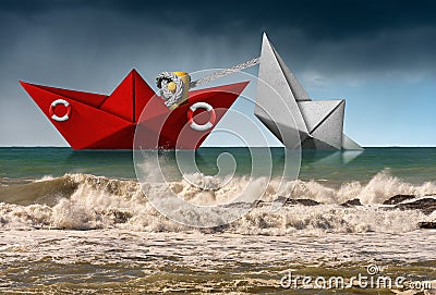 Rescue concept - Coast guard paper boat with lifebuoy Stock Photo