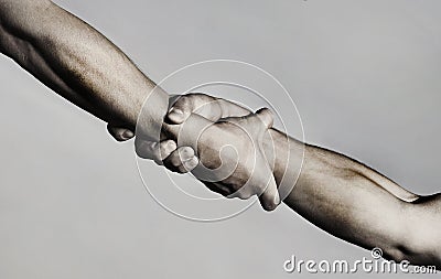 Rescue, helping gesture or hands. Strong hold. Two hands, helping hand of a friend. Handshake, arms, friendship Stock Photo