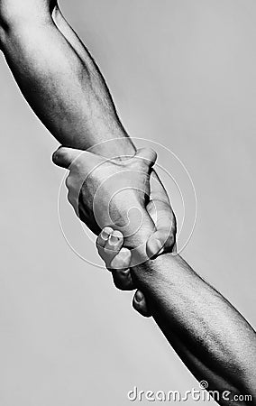 Rescue, helping gesture or hands. Strong hold. Two hands, helping hand of a friend. Handshake, arms, friendship Stock Photo