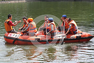 Rescue, red, cross, member, practice, inlatable, boat, solo, central, java, indonesia Editorial Stock Photo