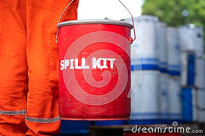 A rescue team is holding red box of `Spill kit`. Stock Photo