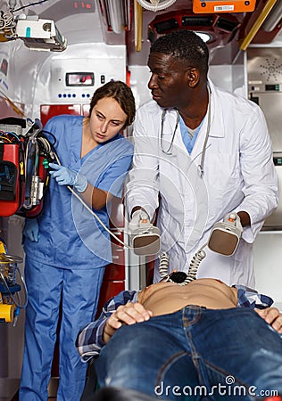 Rescue team making defibrillation to patient Stock Photo