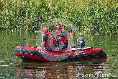 Rescuers, firefighters, supervise the races of amateur vessels Editorial Stock Photo