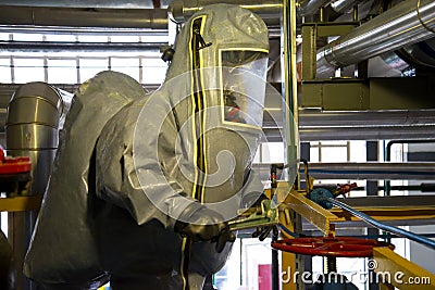 Rescuers in a radiation protection suit Stock Photo