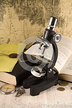Research concept - microscope and books Stock Photo