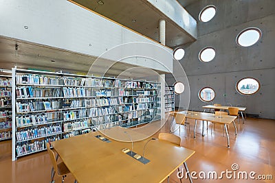 The Research Library is a public university library. Modern interior with round windows and bookshelves Beautiful an extraordinary Editorial Stock Photo