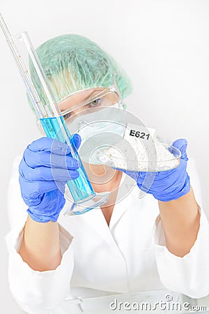 Researcher with food and preservatives Stock Photo