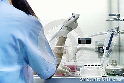 The researcher is using pipette Stock Photo