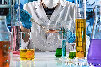 Researcher working with cell culture flask in the clinical laboratory Stock Photo