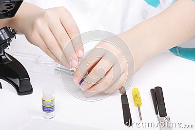 Researchers hands with various objects Stock Photo