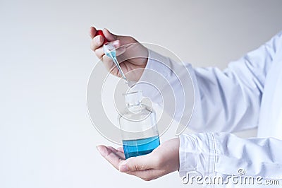 The researchers took the reagent bottle Stock Photo