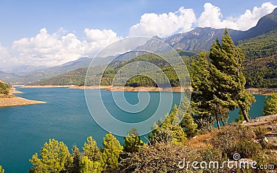 Reservoir and mountains in the background. Stock Photo