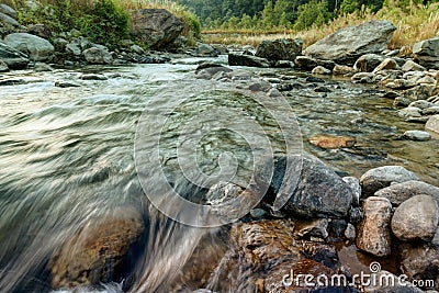 Reshi River water flowing on rocks at dawn, Sikkim, India Stock Photo