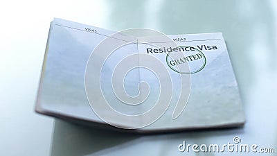 Residence visa granted, seal stamped in passport, customs office, travelling Stock Photo