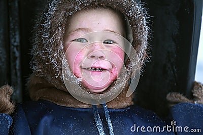 A resident of the tundra, indigenous residents of the Far North, tundra, open area, children ride on sledges, children in Stock Photo