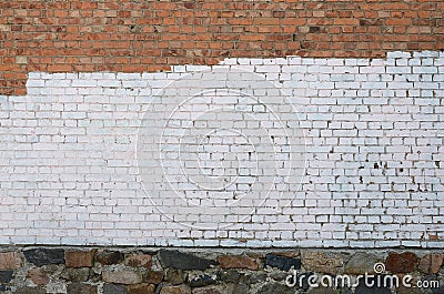 Residental house wall with white paint patches covering graffiti vandalism Stock Photo