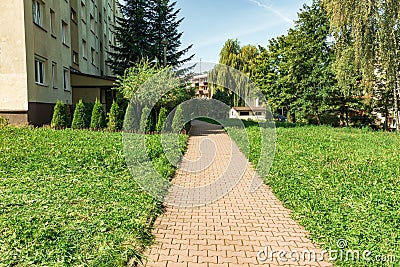 Residential building alley green grass Stock Photo