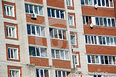 Residential building wall with windows and balconies Stock Photo