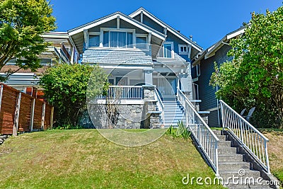 Residential house with concrete stairway over terrace to the entrance. Stock Photo