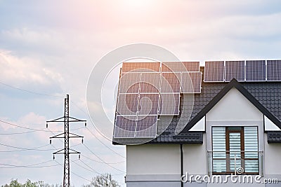 Residential house with rooftop covered with solar photovoltaic panels for producing of clean ecological electrical Stock Photo
