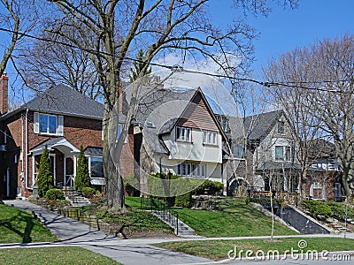 Residential street with large detached houses Stock Photo