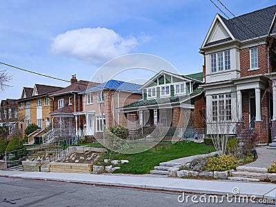 Residential street with a variety of older and newer houses Stock Photo