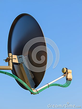 Residential TV receiver satellite dish with low-noise block downconverter LNB. Satellite dish antenna with octo monoblock Stock Photo