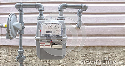 Residential urban natural gas meter measuring gas consumption, outside house gas meter Stock Photo