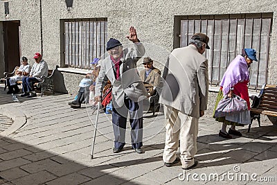 Residents of an elderly persons home in the old city seeking the warmth of the early morning sun in La Paz in Bolivia. Editorial Stock Photo