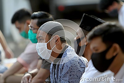 Residents perform Eid al-Adha prayers in a housing complex in Bogor, West Java, Indonesia, Friday 31 July 2020. The health Editorial Stock Photo