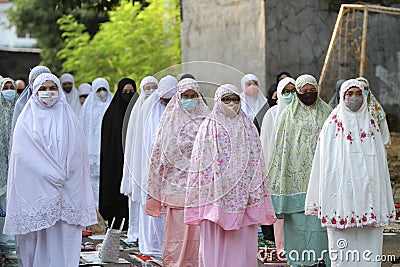 Residents perform Eid al-Adha prayers in a housing complex in Bogor, West Java, Indonesia, Friday 31 July 2020. The health Editorial Stock Photo